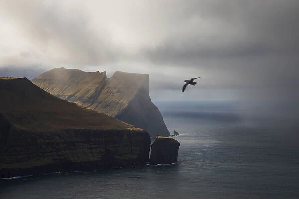 Stakkurin sea stack and the northern side of the island of Streymoy. Faroe Islands