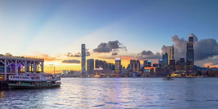 Framed Print : Star Ferry at Wan Chai Pier and Kowloon skyline at sunset, Hong Kong Framed Print : Star Ferry at Wan Chai Pier and Kowloon skyline at sunset, Hong Kong