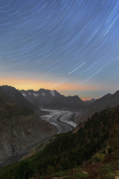 Star trail above the glacial tongue of the Aletsch glacier,Bernese Alps, Valais canton, Switzerland