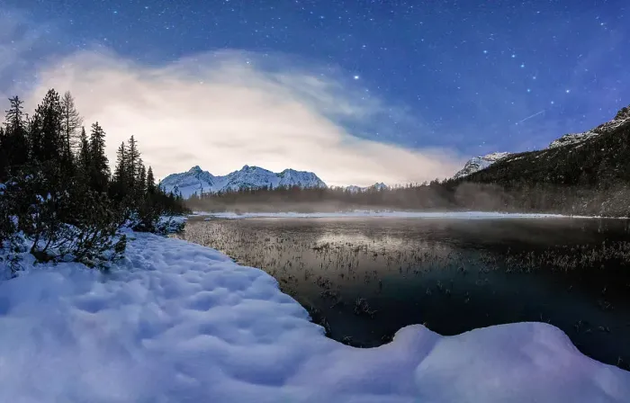 Framed Print : Stars over the frozen lake Entova and snowy forest at night, Valmalenco, Valtellina, Sondrio province, Lombardy, Italy