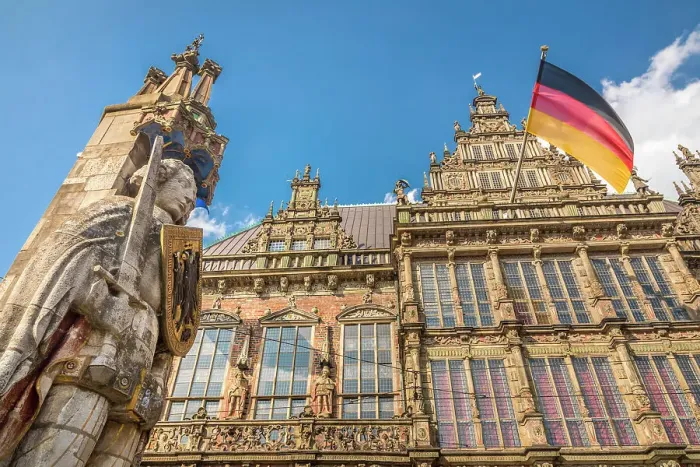 Framed Print : Statue of Bremen Roland in front of the town hall with the German flag on the market square, Bremen, Germany Framed Print : Statue of Bremen Roland in front of the town hall with the German flag on the market square, Bremen, Germany