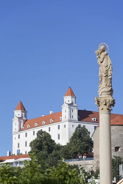 Statue at Capuchin Church with Bratislava Castle, Bratislava, Slovakia
