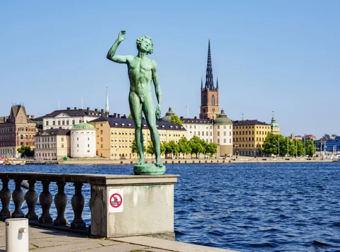 Framed Print : Statue in the City Hall Garden with Riddarholmen Islet in the background, Stockholm, Stockholm County, Sweden