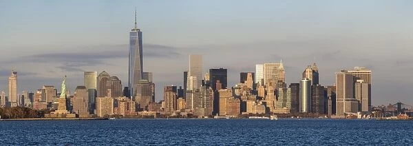 Statue of Liberty, One World Trade Center and Downtown Manhattan across the Hudson River