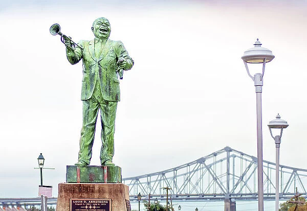 Statue of Louis Armstrong, Jazz Walk of Fame located in Algiers Point across the Mississippi River from New Orleans, The Crescent City Connection (twin cantilever bridges), Louisiana, USA