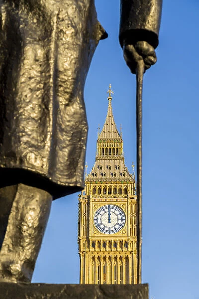 Statue of Winston Churchill, a former British Prime Minister and Big Ben, also known as Elizabeth Tower. Part of the Houses of Parliament and a Unesco World Heritage site, London, England, UK