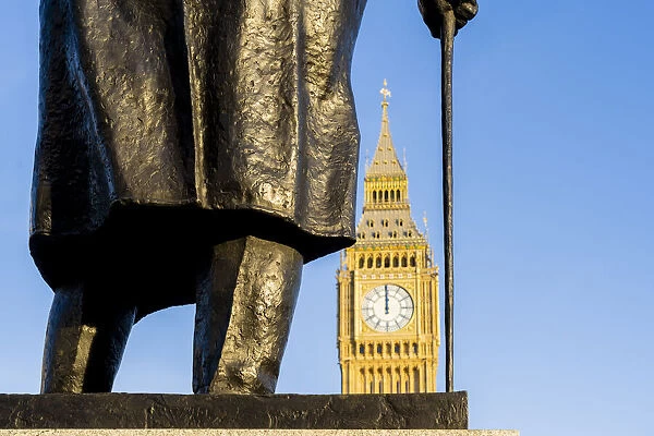 Statue of Winston Churchill, a former British Prime Minister and Big Ben, also known as Elizabeth Tower. Part of the Houses of Parliament and a Unesco World Heritage site, London, England, UK