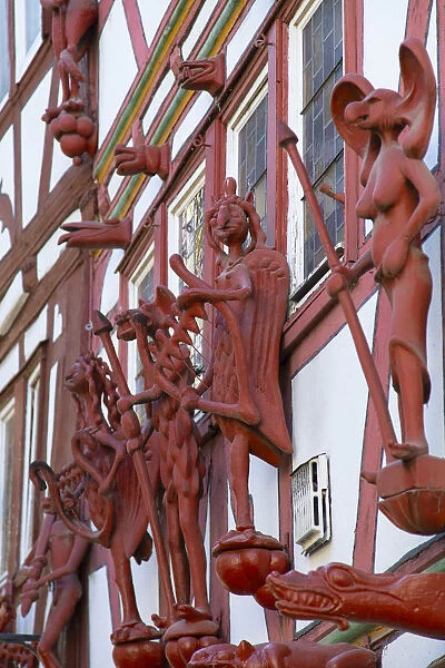 Statues on half-timbered buildings, Limburg, Hesse, Germany