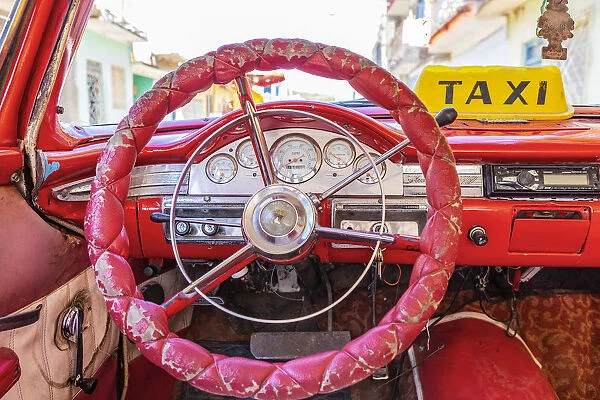 Steering wheel and dashboard in a classic car in Trinidad, Sancti Spiritus, Cuba
