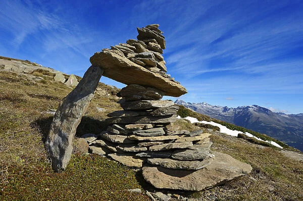 Steinmann or stone man at the summit of evil Weibele in the Deferegger group, Carnic
