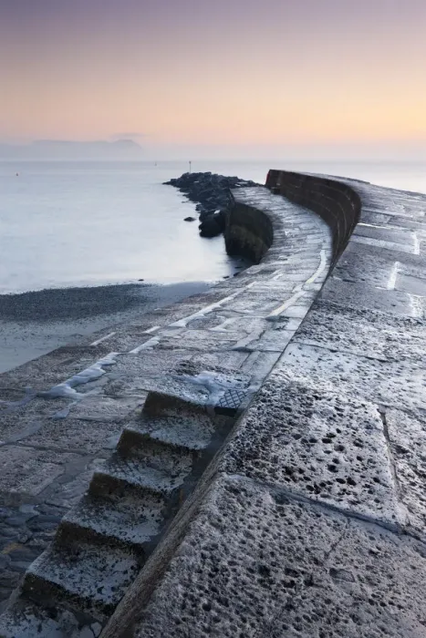 Framed Print : Steps leading onto the Cobb harbour wall at Lyme Regis on the Jurassic Coast, Dorset, England. Winter (December) 2010 Framed Print : Steps leading onto the Cobb harbour wall at Lyme Regis on the Jurassic Coast, Dorset, England. Winter (December) 2010