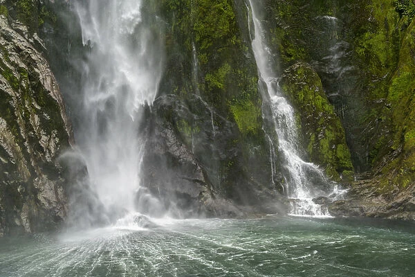 Stirling Falls reaching the sea in Milford Sound. Fiordland NP, Southland district