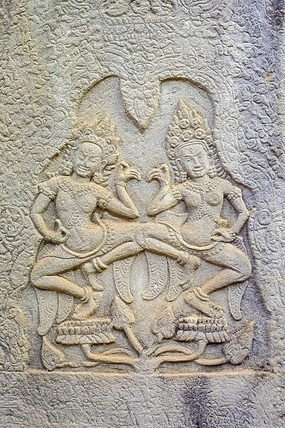 Stone carvings of Apsara dancers at Prasat Bayon temple ruins, Angkor Thom, UNESCO