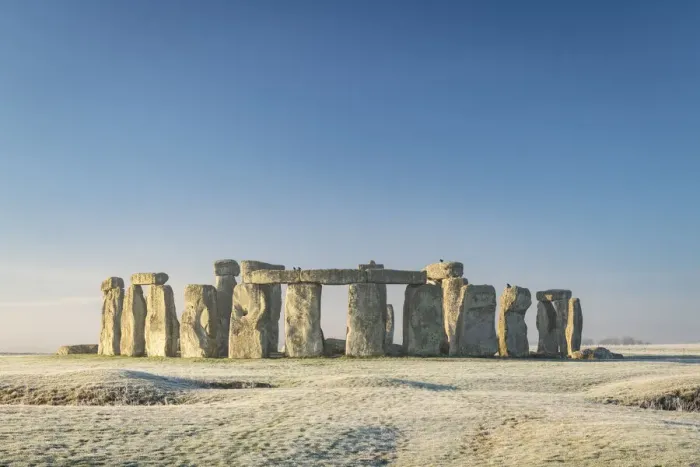 Framed Print : Stonehenge at dawn on a chill frosty winter morning, Wiltshire, England. Winter (January) 2022