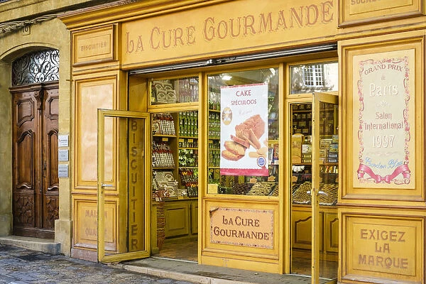 Storefront of La Cure Gourmande specialty biscuit shop on Place Richelme, Aix-en-Provence