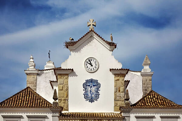 Storks on Chapel Nossa Senhora dos Aflitos, Olhao, Algarve, Portugal