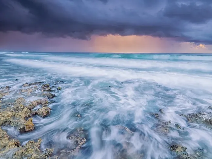 Framed Print : Storm clouds at daybreak on the Caribbean Sea along the rugged ironshore of Grand Cayman in the Cayman Islands, British West Indies Framed Print : Storm clouds at daybreak on the Caribbean Sea along the rugged ironshore of Grand Cayman in the Cayman Islands, British West Indies
