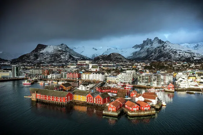 Framed Print : Storm clouds in the foggy sky over the snowcapped mountains surrounding Svolvaer, aerial view, Lofoten Islands, Norway Framed Print : Storm clouds in the foggy sky over the snowcapped mountains surrounding Svolvaer, aerial view, Lofoten Islands, Norway