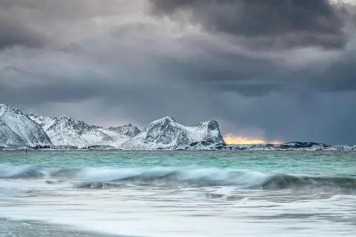 Framed Print : Storm clouds at sunset over snowcapped mountains and cold arctic sea, Bovaer beach, Skaland, Senja, Troms county, Norway