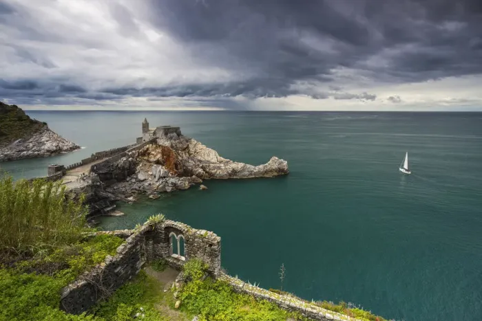 Framed Print : Stormy clouds over Portovenere and church of San Pietro, La Spezia, Liguria, Italy