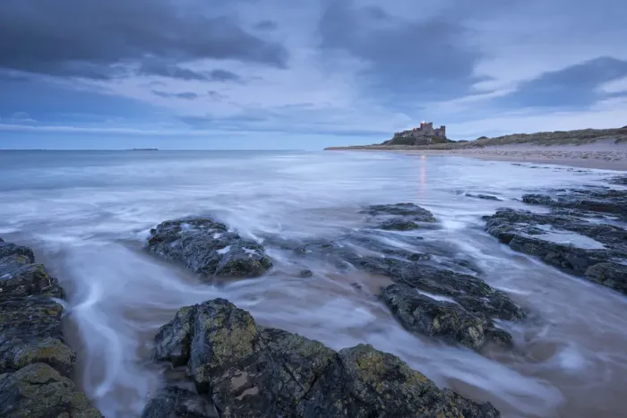 Framed Print : Stormy evening on the beach near Bamburgh Castle, Northumberland, England. Winter Framed Print : Stormy evening on the beach near Bamburgh Castle, Northumberland, England. Winter