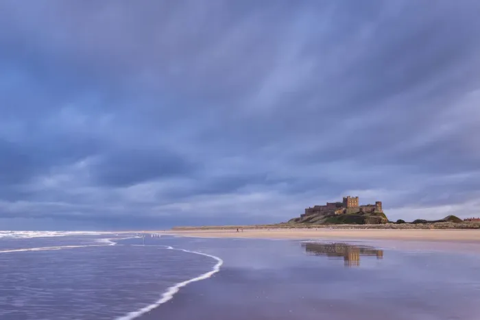 Framed Print : Stormy sky above Bamburgh Castle in Northumberland, England. Spring