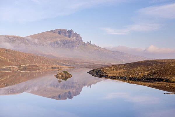 The Storr reflected in the tranquil water of Loch Fada, Isle of Skye, Scotland. Autumn