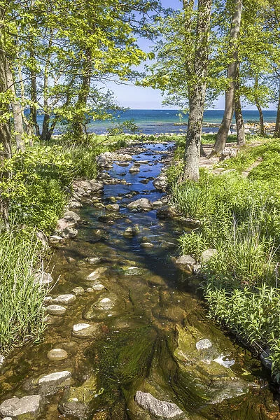 Stream flows into the Baltic Sea at Listed on Bornholm, Denmark