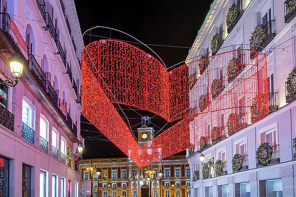 Street adorned with Christmas lights near Puerta del Sol, Madrid, Spain