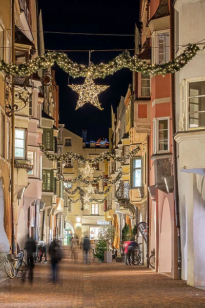Street adorned with festive Christmas decorations, Brixen-Bressanone, South Tyrol, Italy