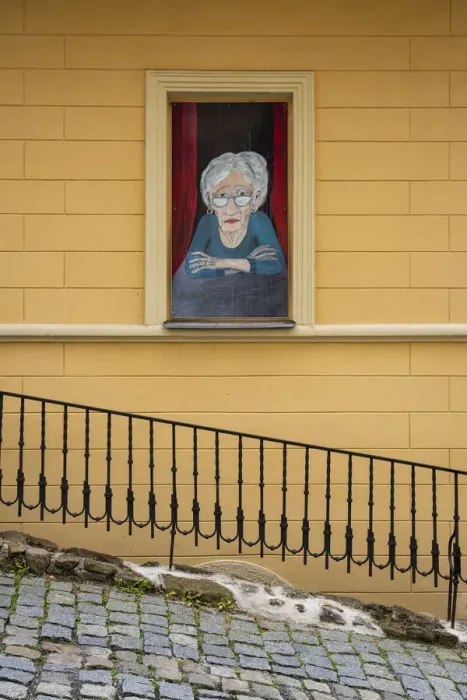 Framed Print : Street art of senior woman looking out of window, Loket, Sokolov District Framed Print : Street art of senior woman looking out of window, Loket, Sokolov District