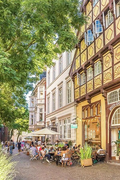 Street cafes and Degodehaus in the old town of Oldenburg, Oldenburger Land, Lower Saxony, Germany