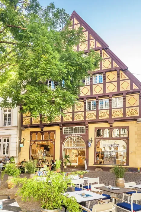 Framed Print : Street cafes and Degodehaus in the old town of Oldenburg, Oldenburger Land, Lower Saxony, Germany Framed Print : Street cafes and Degodehaus in the old town of Oldenburg, Oldenburger Land, Lower Saxony, Germany