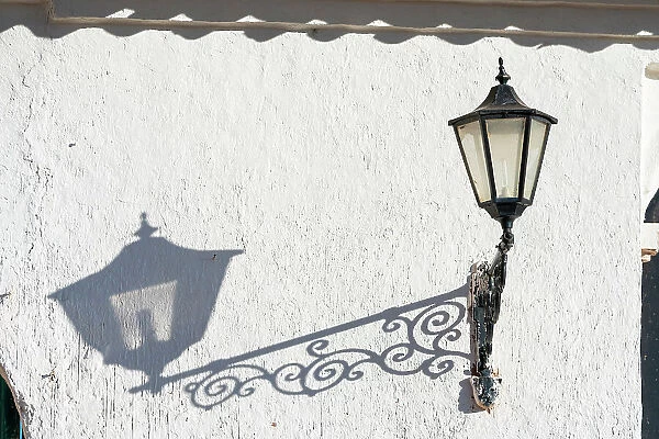 Detail of street lamp and its shadow, near Iglesia de Nuestra Senora de la Natividad Church, Chinchero, Sacred Valley, Urubamba Province, Cusco Region, Peru