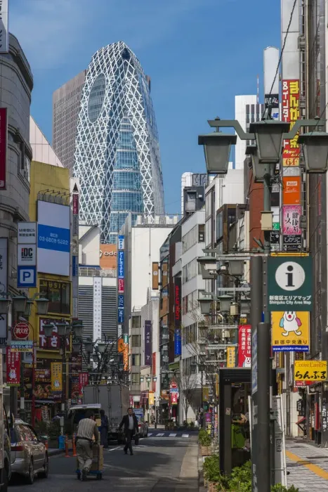 Framed Print : Street in Shinjuku district with Cocoon Tower in the background, Tokyo, Japan Framed Print : Street in Shinjuku district with Cocoon Tower in the background, Tokyo, Japan