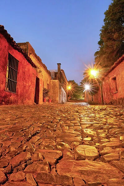 The 'Street of Sighs' (Spanish: Calle de los Suspiros) at twilight, in the historical cask of Colonia de Sacramento, Uruguay. Colonia was declared UNESCO World Heritage Site in 1995