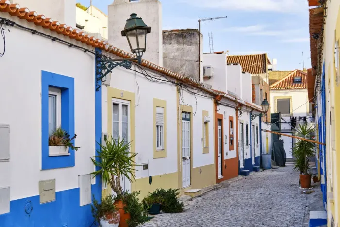 Framed Print : Street of the traditional fishing village of Alcochete, spreading along the river Tagus Framed Print : Street of the traditional fishing village of Alcochete, spreading along the river Tagus