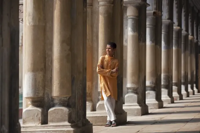 Framed Print : A student relaxes beside the pillars of the impressive Hugli Imambara building which was built in 1858 and is used as a school Framed Print : A student relaxes beside the pillars of the impressive Hugli Imambara building which was built in 1858 and is used as a school