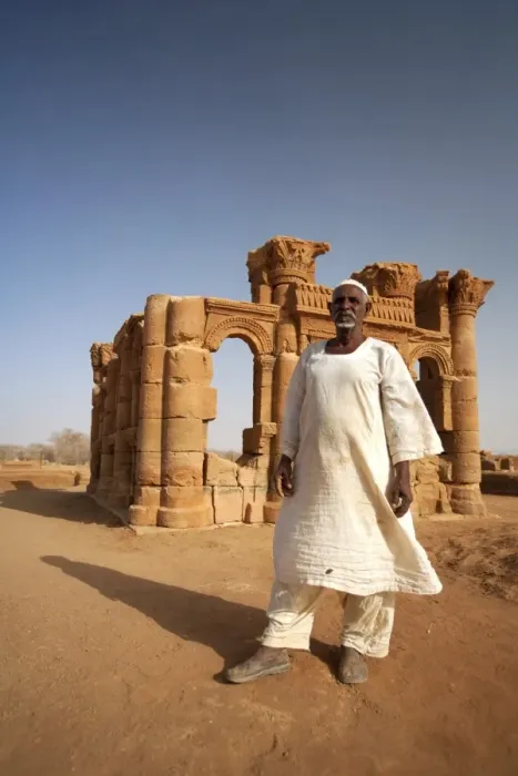 Framed Print : Sudan, Nagaa. The solitary guide at the remote ruins of Nagaa stands in front of the ruins Framed Print : Sudan, Nagaa. The solitary guide at the remote ruins of Nagaa stands in front of the ruins