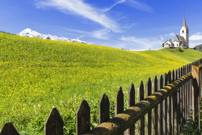 Framed Print : Summer flowering at the traditional church of Davos Wiesen, Parc Ela, Prettigau  /  Davos