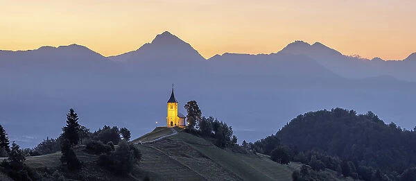Summer sunrise over Church of St. Primoz, Jamnik, Slovenia