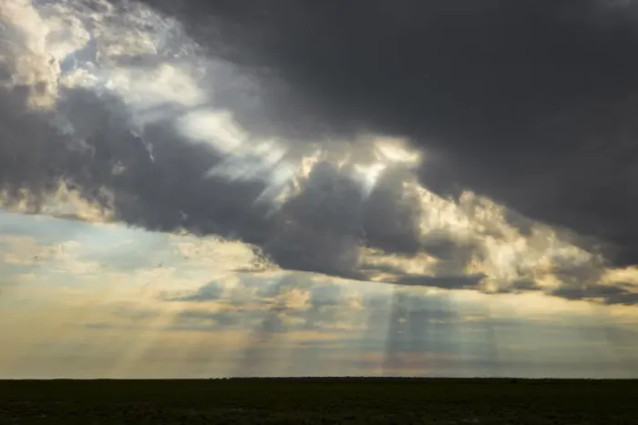 Framed Print : Sun beams breaking through storm clouds, Liuwa Plain National Park, Zambia Framed Print : Sun beams breaking through storm clouds, Liuwa Plain National Park, Zambia