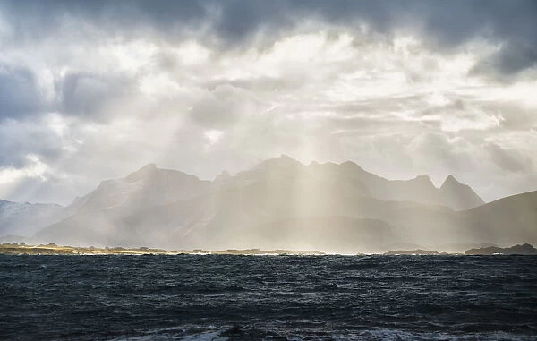 Sun rays on Flakstadoya seen from Vareid, Nordland, Lofoten Islands, Norway