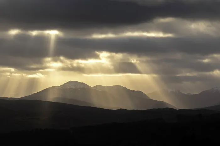 Framed Print : Sun rays over the mountains of Cluanie Forest and Glenquoich Forest viewed from Glen Garry, Highland Region, Scotland, UK, February 2025 Framed Print : Sun rays over the mountains of Cluanie Forest and Glenquoich Forest viewed from Glen Garry, Highland Region, Scotland, UK, February 2025