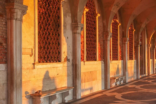 Sun Rays at Sunrise through the Arches of Palazzo Ducale (Doges Palace) St Mark