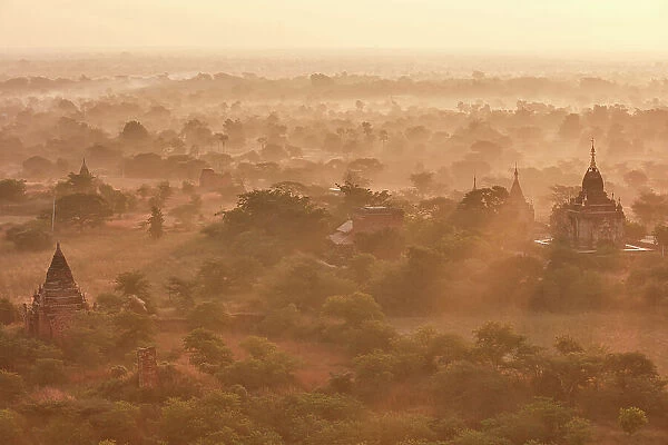 Sun rays at sunrise over the Bagan Valley archaeological area temples, Old Bagan, Mandalay Region, Myanmar. Bagan was declared a UNESCO World Heritage Site in 2019