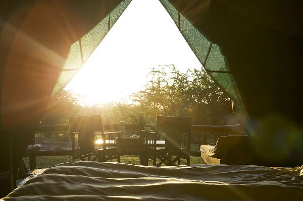 Sun rises into safari tent, from the bed, Tanzania