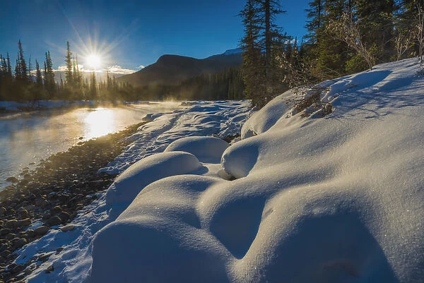Sun Rising over Bow River in Winter, Banff National Park, Alberta, Canada over Bow