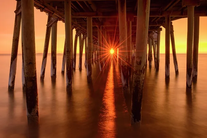 Framed Print : Sun rising through Old Orchard Beach pier, Old Orchard, Maine, USA Framed Print : Sun rising through Old Orchard Beach pier, Old Orchard, Maine, USA