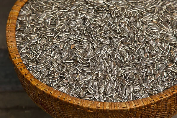 Sunflower seeds in basket, Old Quarter, Hanoi, Vietnam